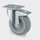 ZWENKWIEL MET DUBBELE REM, VORK VAN GEPERST STAAL, VERZINKT, DUBBELE KOGELDRAAIKRANS IN DE ZWENKKOP, WIELAS GESCHROEFD, STOFAFDICHTING, PLAATBEVESTIGING. WIELKERN VAN POLYAMIDE MET NIET-STREPENDE, ELASTISCHE RUBBERBAND, WIELNAAF OP ROLLAGER